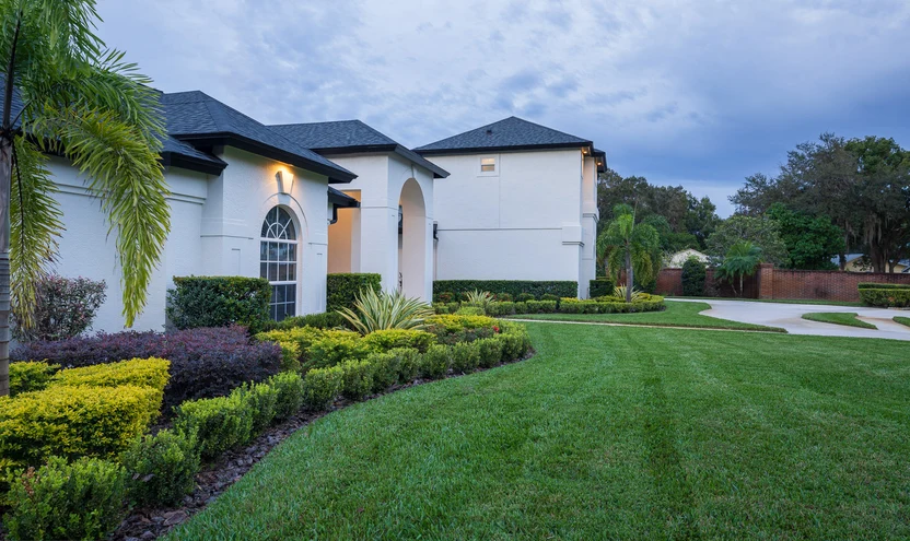 A completed TSL landscape project surrounding a refined Florida home